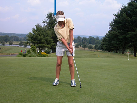 Young Pro Golfer in backswing showing how her head moves backward - Keiser Golf