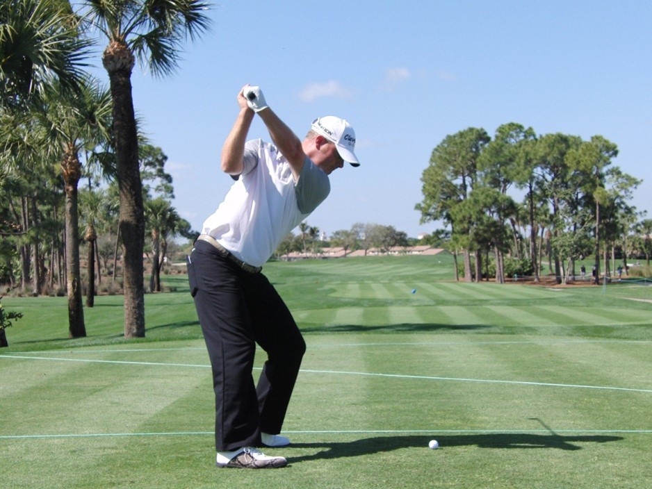 Golfer showing the proper hand position above the shoulder during your swing - KUCOG