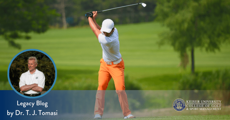 Golfer finishing a swing on fairway, featuring Dr. T. J. Tomasi from Keiser University College of Golf.