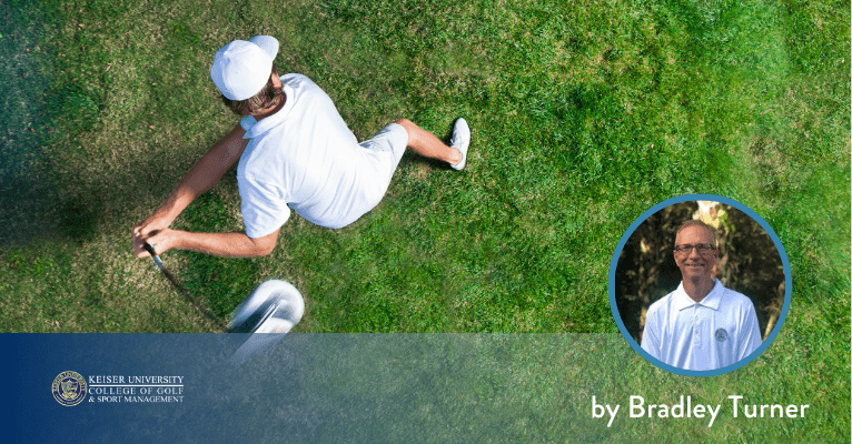 Overhead view of a golfer rotating through the swing on a grassy fairway.